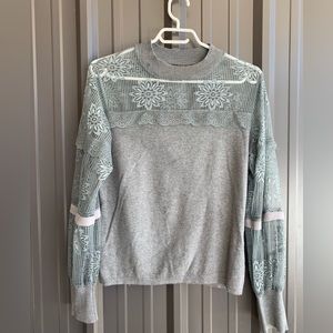 Sweater with lace.